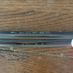 Woman’s bracelet 7”, 6 leather strands, 2 with gem decorations. Magnet clasp.